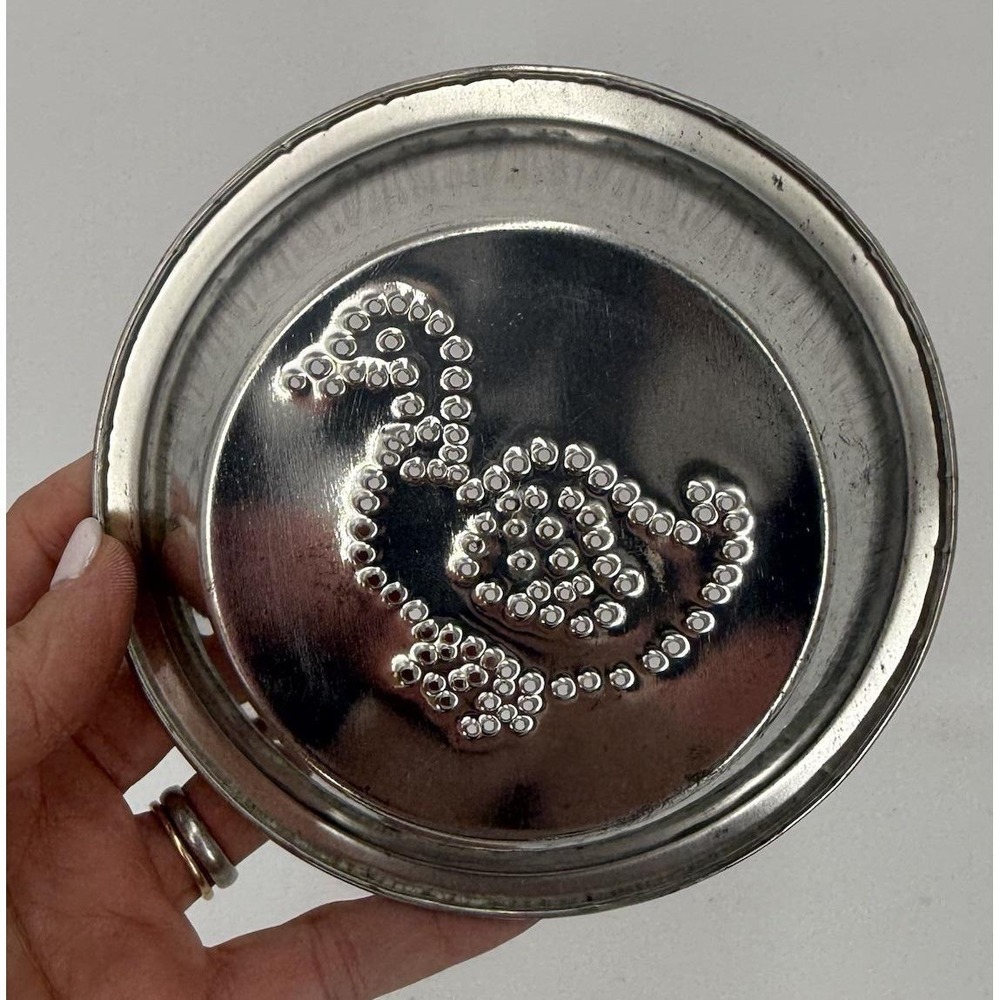 Vintage metal Dish/Tin Art featuring  a punched-dot design of a swan/duck
